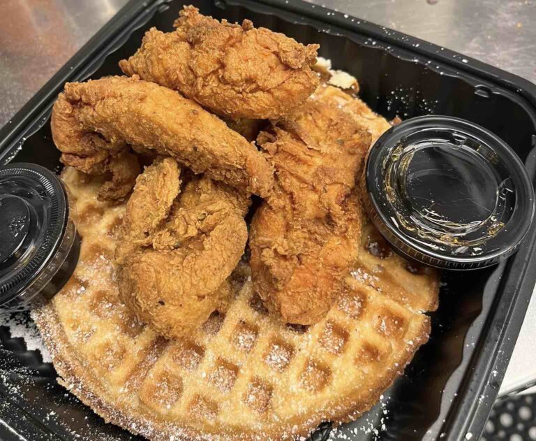 Chicken wings on top of a waffle at The Waffle Shop
