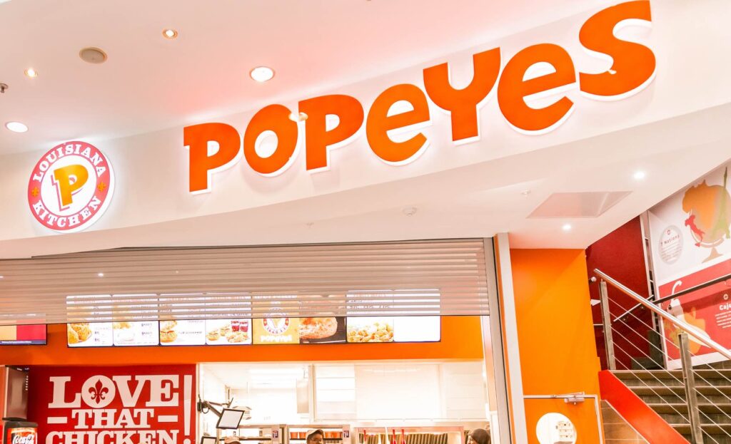 Staff at a Popeyes Take Out Fast Food Restaurant