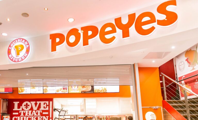 Staff at a Popeyes Take Out Fast Food Restaurant