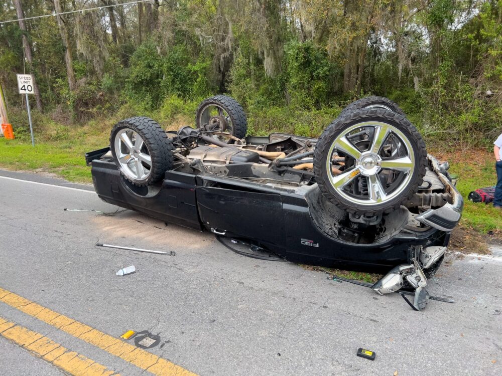 Two vehicle crash in northeast Ocala on March 5, 2024, sends three to hospital overturned pickup (photo by MCFR)