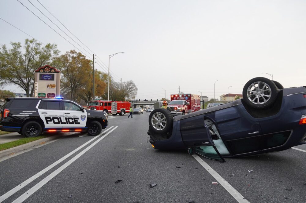 Two vehicle crash with rollover on SW College Road in Ocala on March 1, 2024 blue suv on roof