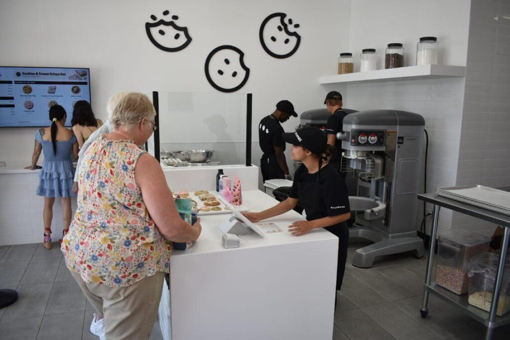 Customers order from Crumbl Cookies in Ocala