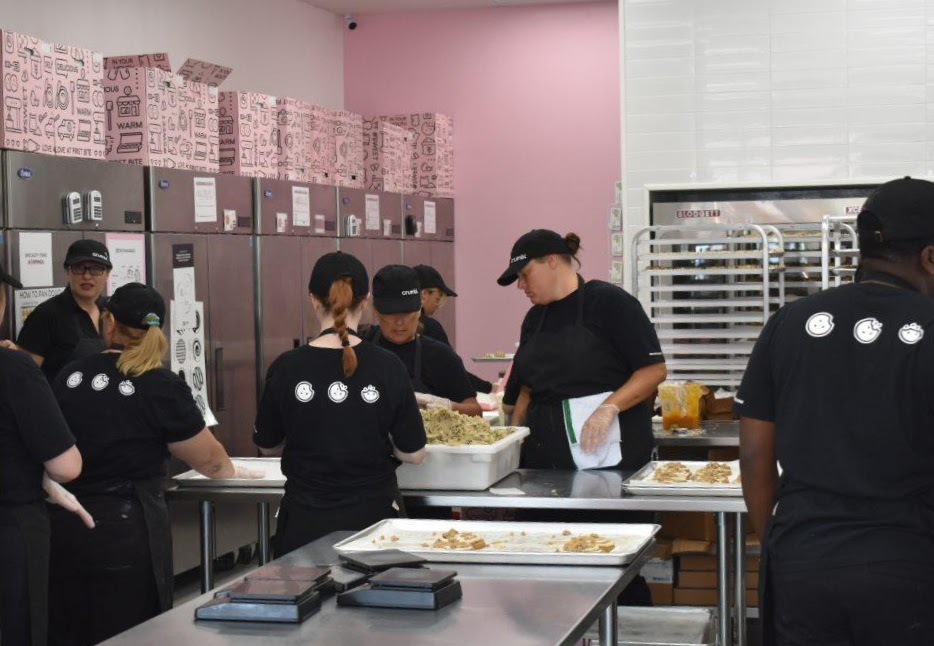 Employees working at the new Crumbl Cookies in Ocala
