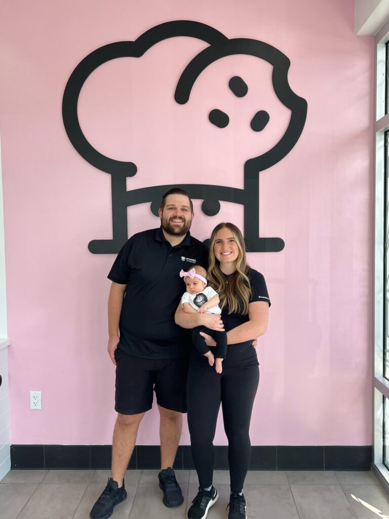 Tanner left and Karli Reaveley with their daughter