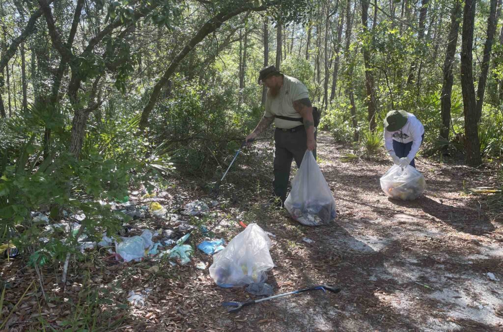 Volunteers collecting trash in the Ocala National Forest