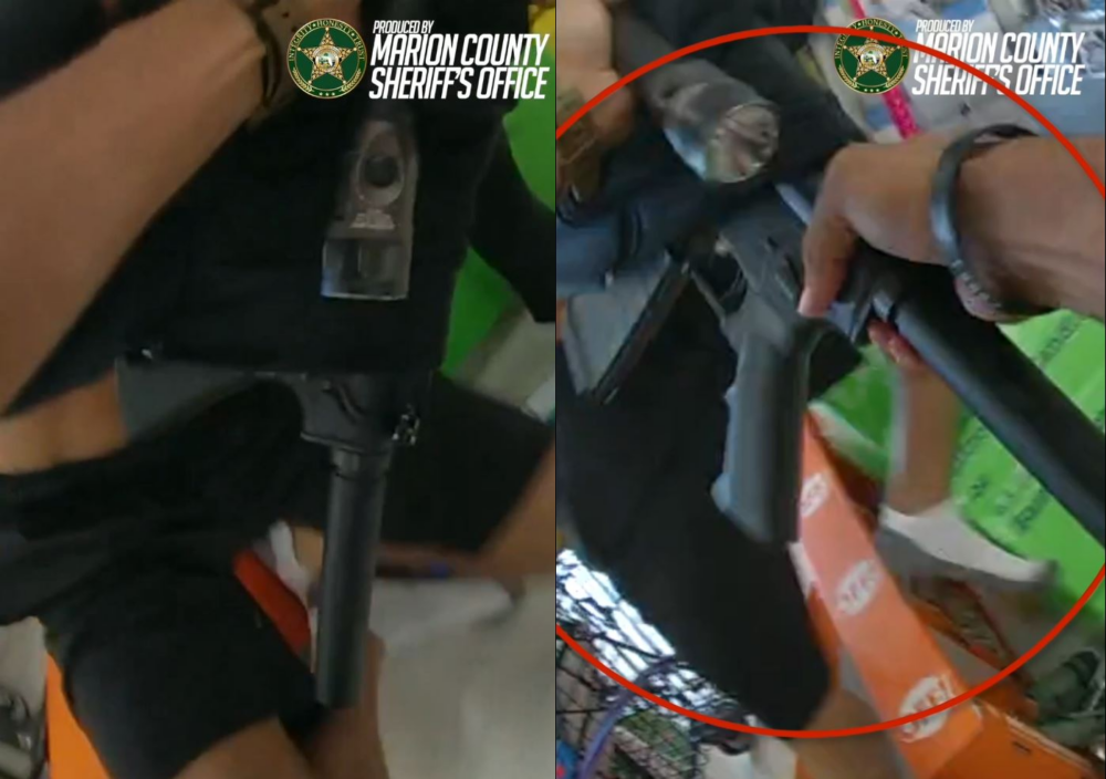 An MCSO deputy grabbing the rifle that was concealed under the 16-year-old boy's shirt. (Photos: Marion County Sheriff's Office)