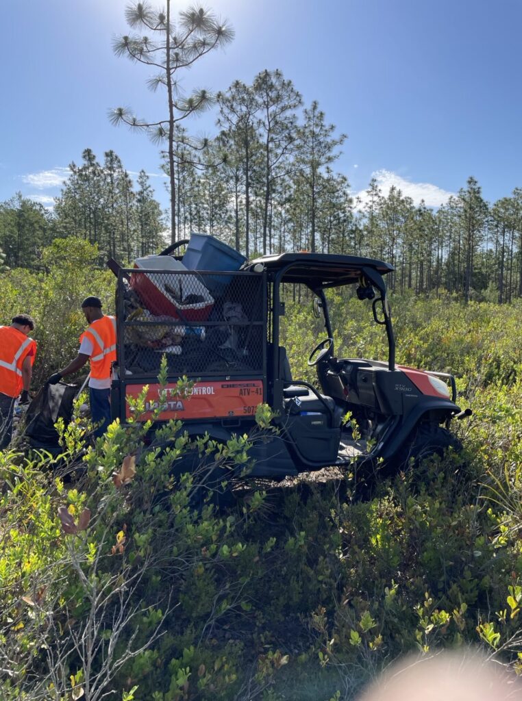 Workers picking up the litter that had been left in the Ocala National Forest. (Photo: Marion County Board of County Commissioners)
