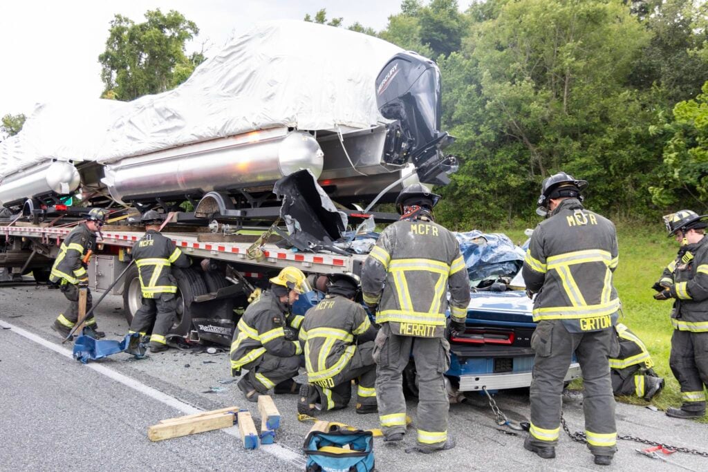 Emergency personnel survey the scene of a fatal accident on I 75 on Sunday