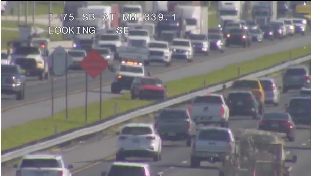 A Road Ranger offers roadside assistance on Thursday afternoon to a disabled vehicle on I-75 in Marion County.