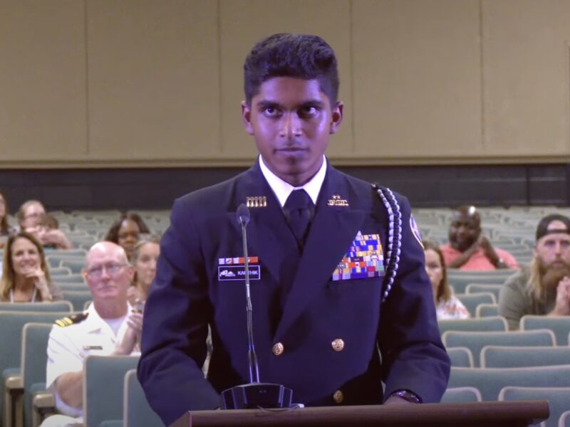 Sanjay Karthik leads the Marion County School Board in the Pledge of Allegiance on Tuesday, November 12.