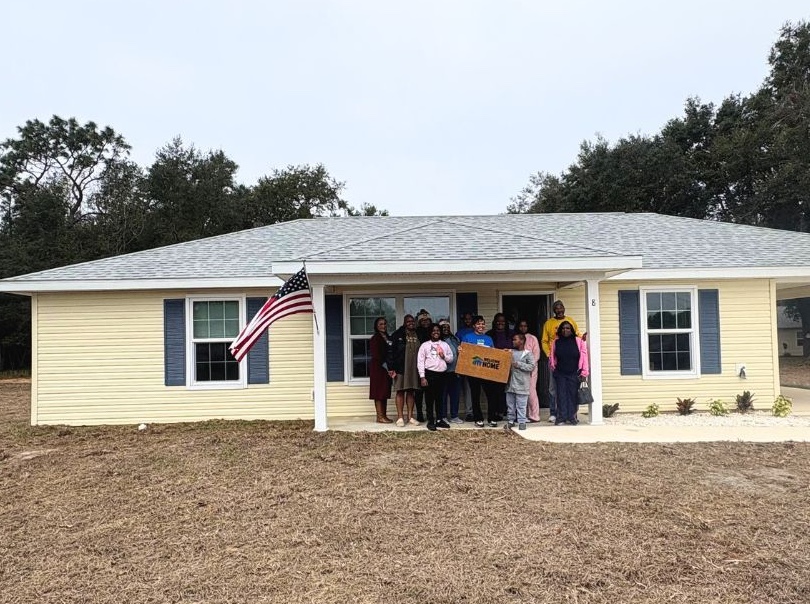 Brittani Davis accepts her new home from Habitat for Humanity