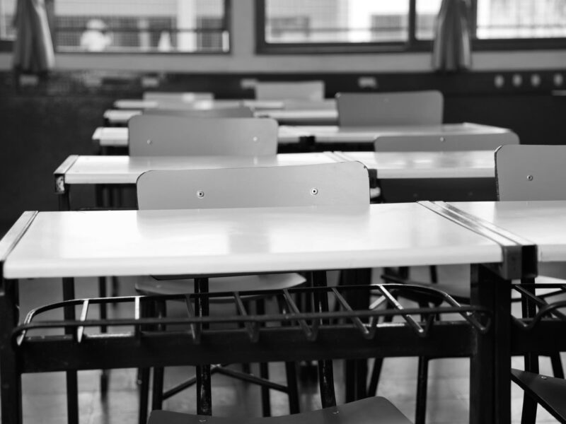 Empty Classroom With Chairs And Desks