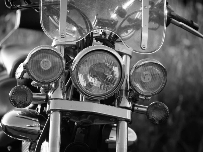 Detail of vintage motorcycle in sunset
