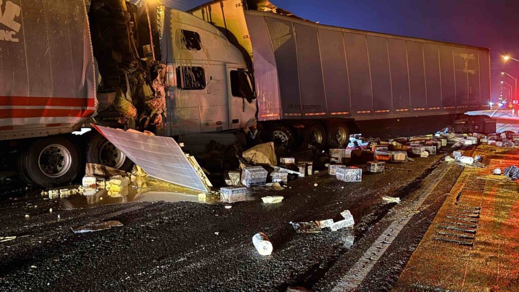 Semi truck in back end of other semi truck