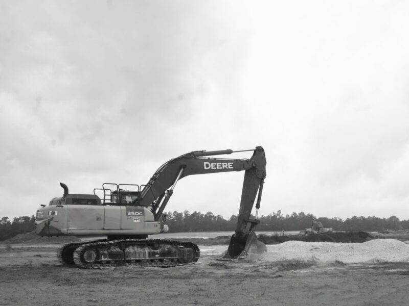 Excavator at cleared site in Ocala