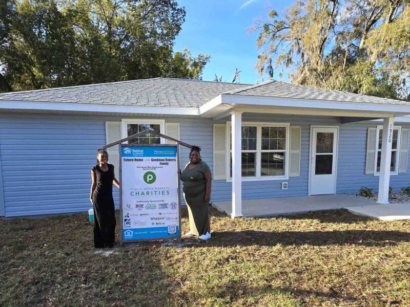 Jacquelyn Goodman and her daughter, Danielle Roberts, outside of their new Habitat for Humanity home