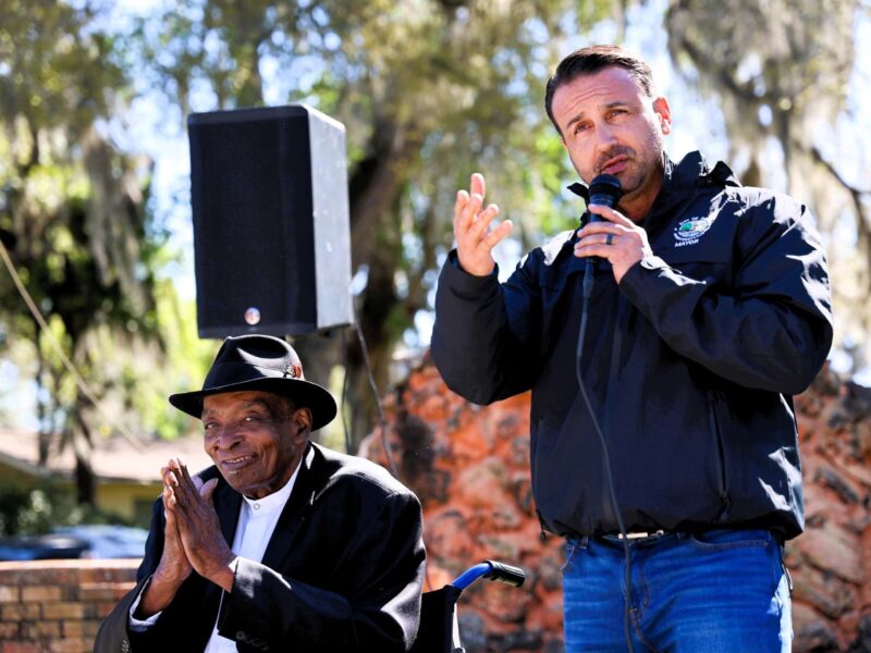 Mayor Ben Marciano speaks next to Whitfield Jenkins as the city renames a stretch of Ocala roadway in his honor.