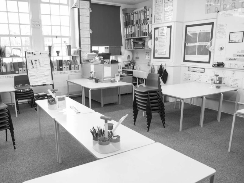 Chairs in an Empty Classroom representing expulsions or expelled students