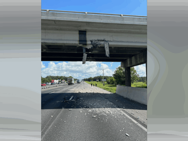 A semi-truck hauling an excavator struck the SW 66th Street overpass in Marion County on Julfy 11, 2025, shutting down the northbound I-75 lanes. (Photo: Marion County Sheriff's Office)