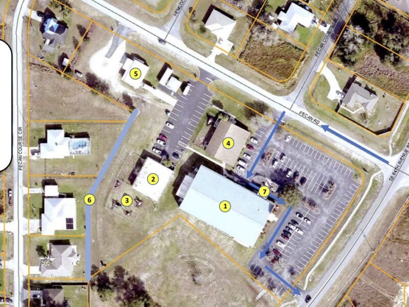 A site plan shows the proposed layout for the school and facilities.