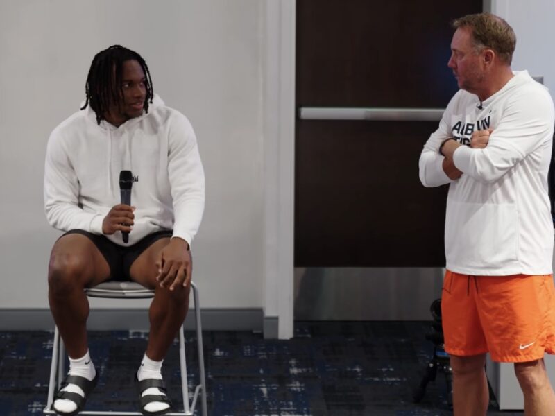 Cam'Ron King (left) and Auburn University Football Coach Hugh Freeze (right)