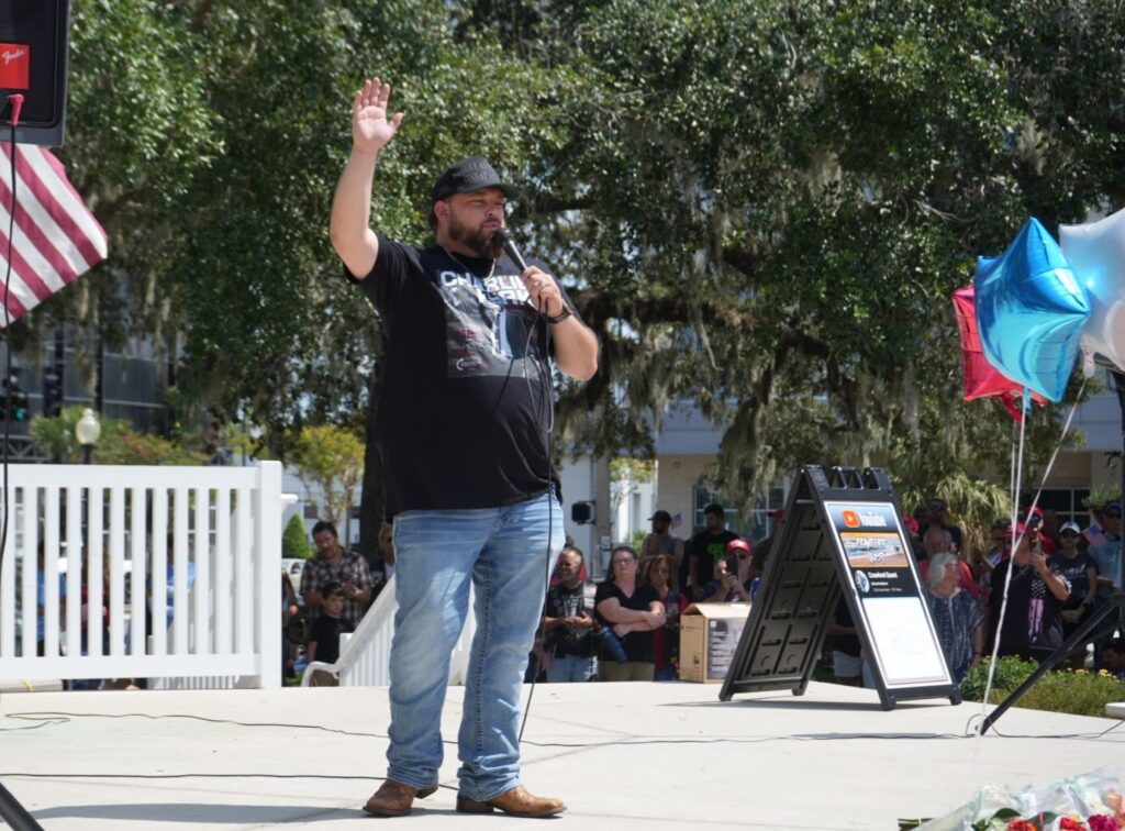 Kendall Tucker addresses the crowd at Saturday s prayer vigil for Charlie Kirk