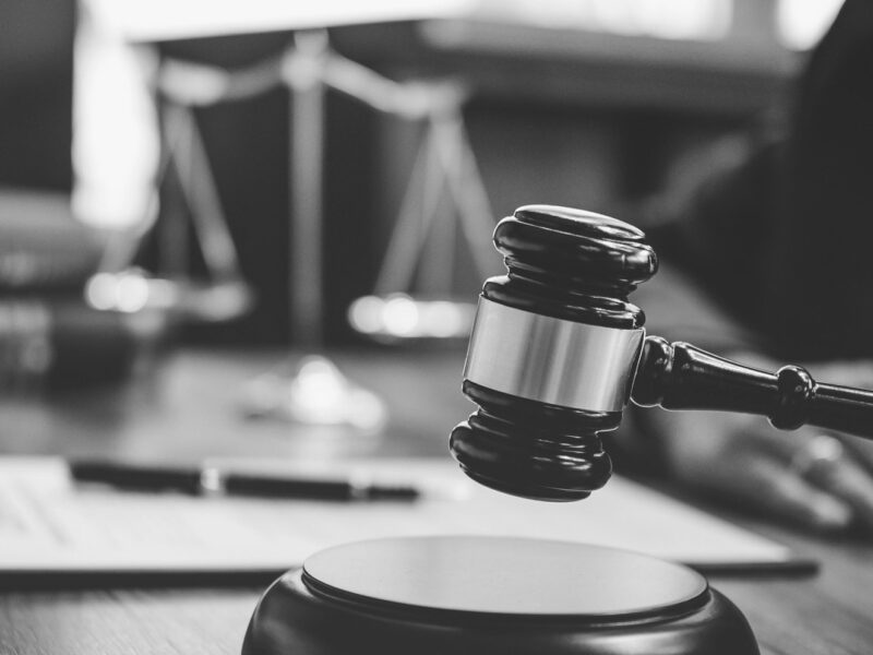 A gavel being hammered by a judge in court.