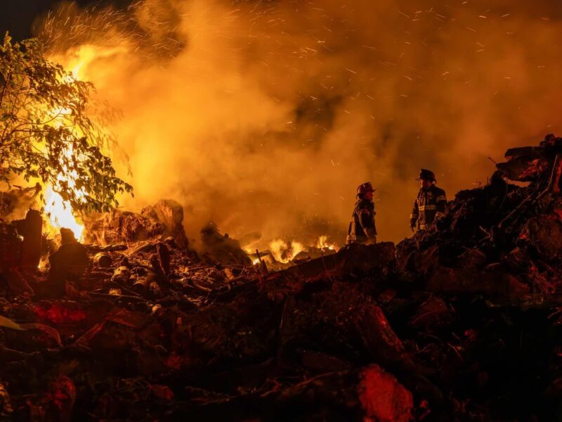 Marion County Fire Rescue firefighters walk through the site of a controlled burn that got out of control on Thursday, October 9.