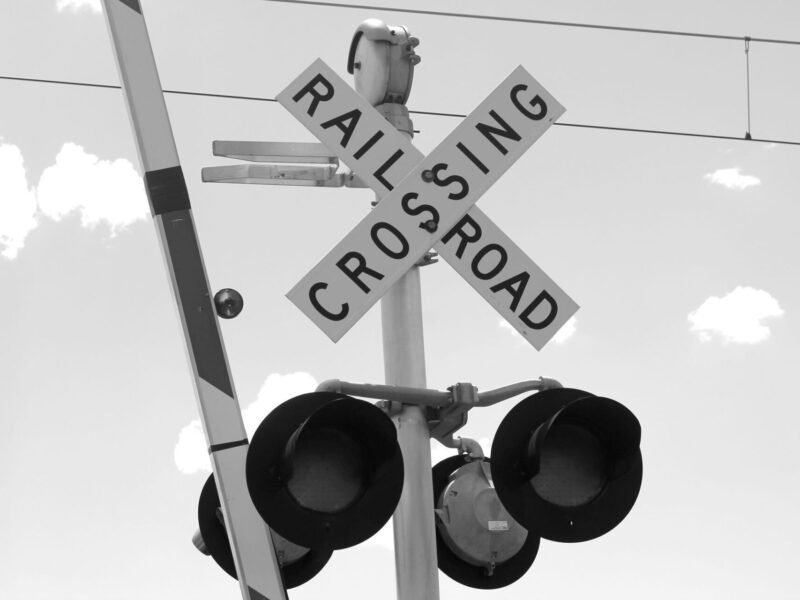 Railroad crossing sign near train tracks