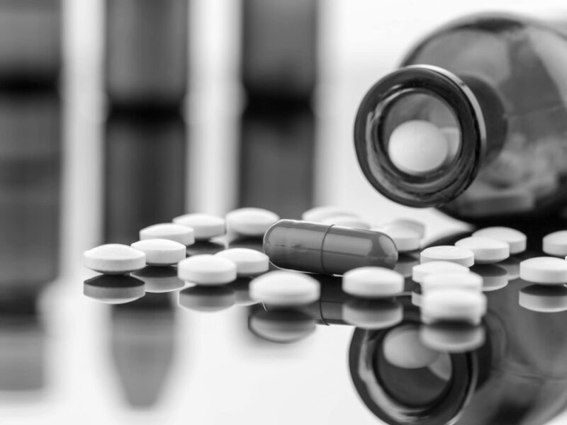 Drugs spilling out of a pill jar