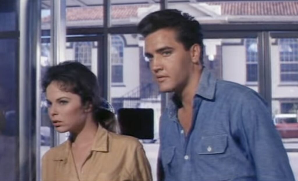 Elvis walks into the bank in Ocala during filming of Follow That Dream 1