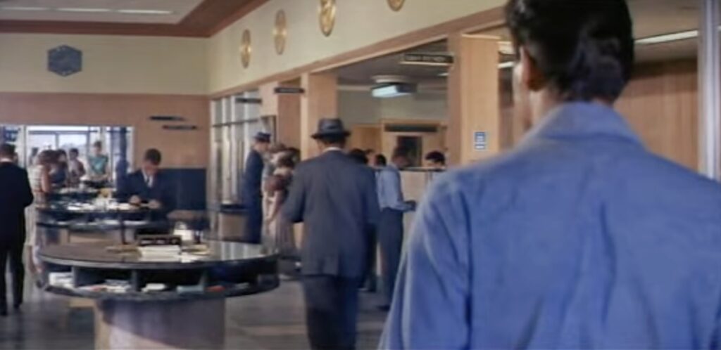 Elvis walks into the bank in Ocala during filming of Follow That Dream