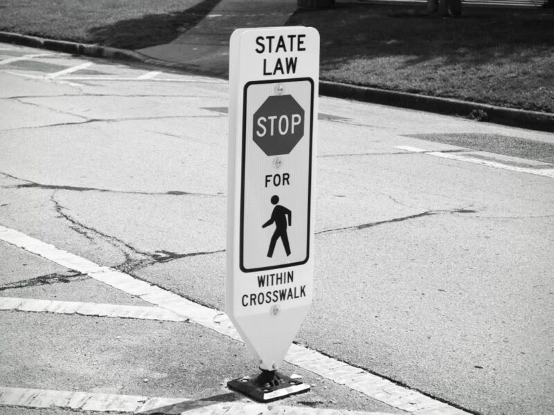 Stop for Pedestrians sign in crosswalk at Tuscawilla Park