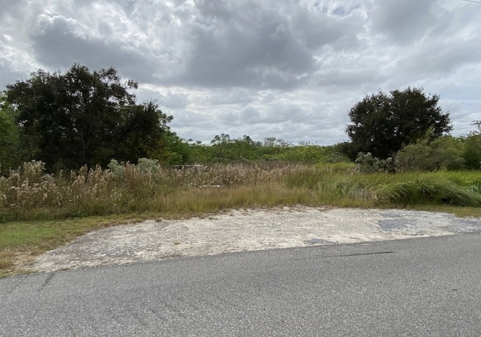 View of the subject property from NW 21st Street, facing south.