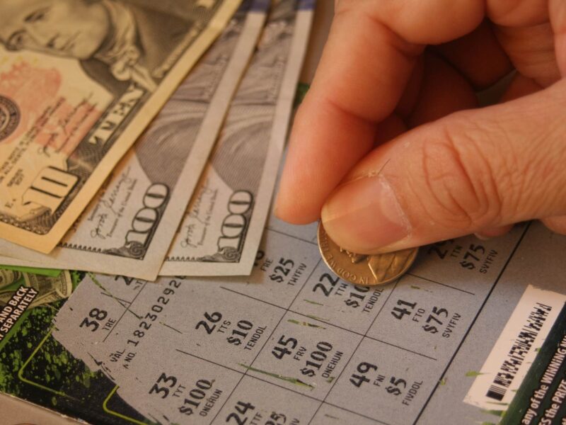 Man scratching off scratch off lottery ticket