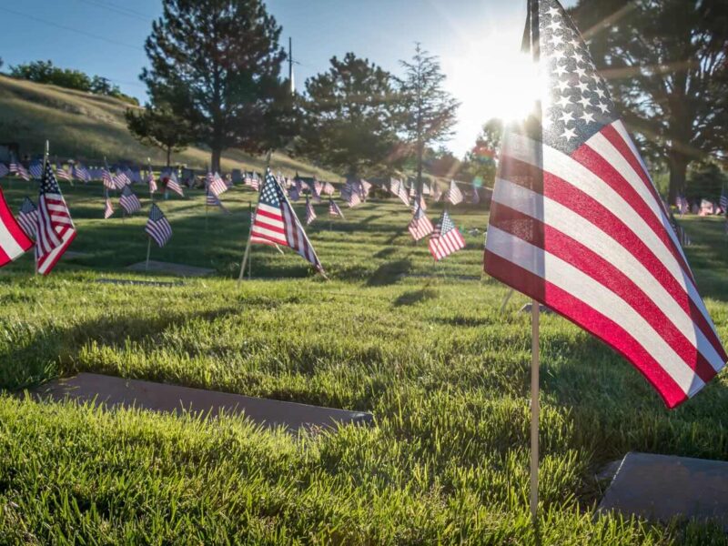United States of America flags on gravesite cemetery headstones at Florida National Cemetery