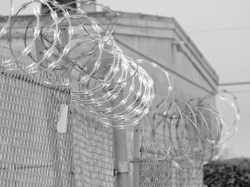 Barbed wire fence outside of jail