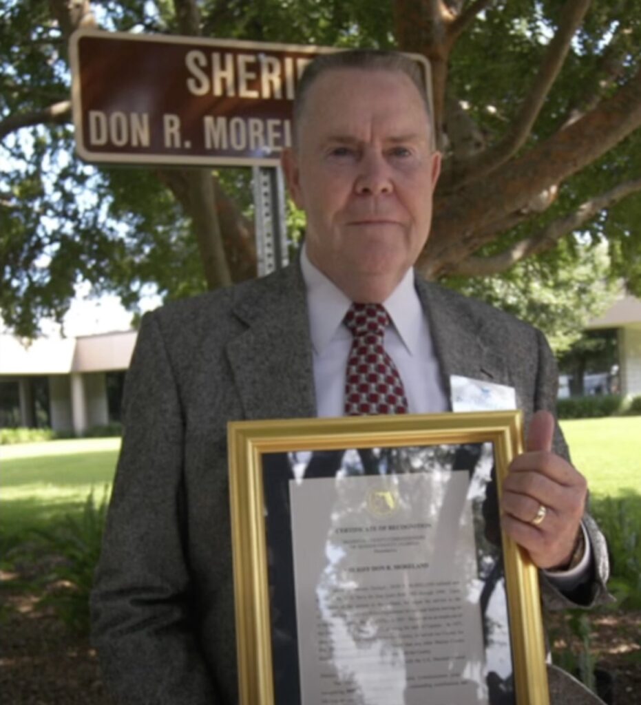 Don R. Moreland accepts dedication of roadway name
