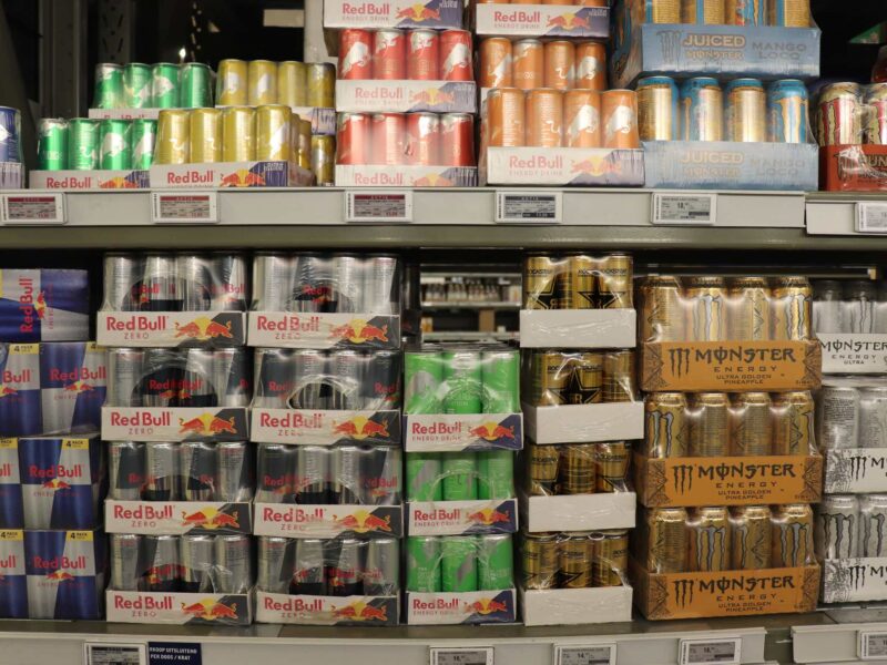 Energy drink boxes stacked at a grocery store
