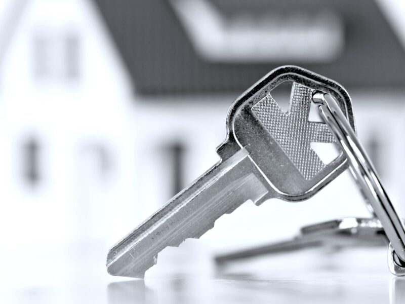Keys in front of a home.