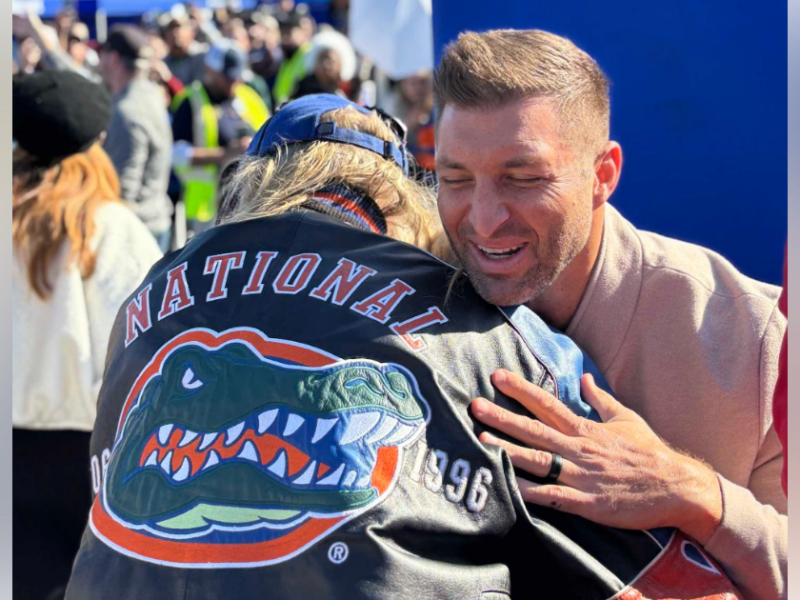 Tim Tebow hugs a fan at the opening of the new Walmart Neighborhood Market in Ocala on January 28, 2026.