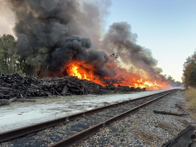 Marion County Fire Rescue crews are currently on scene working to extinguish a fire involving a large stockpile of railroad ties near E McKinney Street and North Williams Street in Dunnellon, FL.