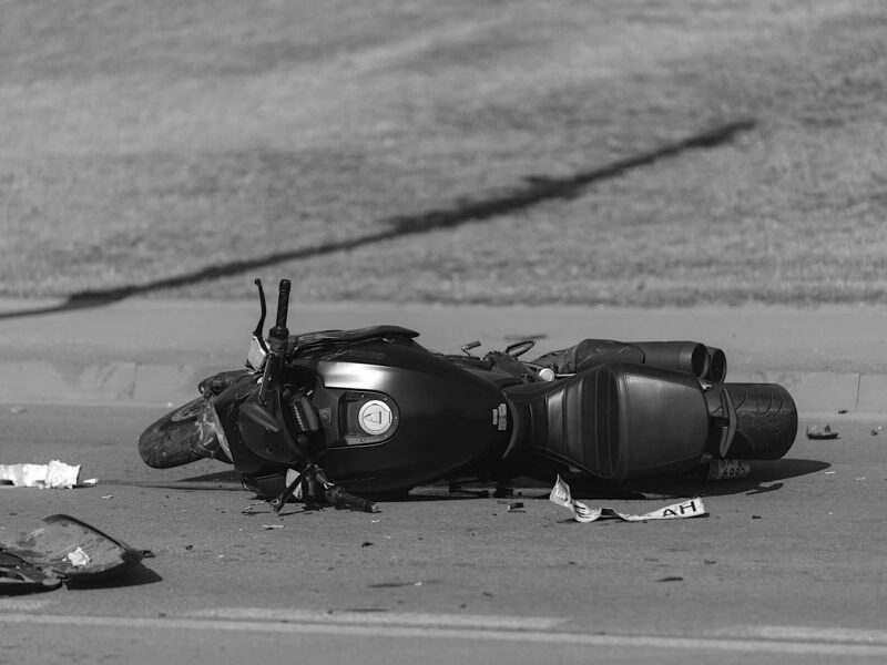 Motorcycle laying on the roadway after accident