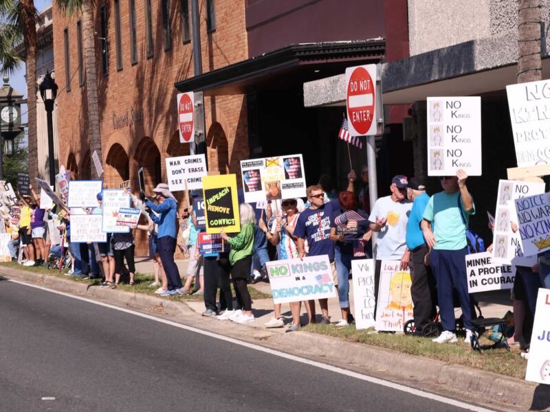 Protestors lined the streets of downtown Ocala in opposition to President Donald J. Trump and his policies.