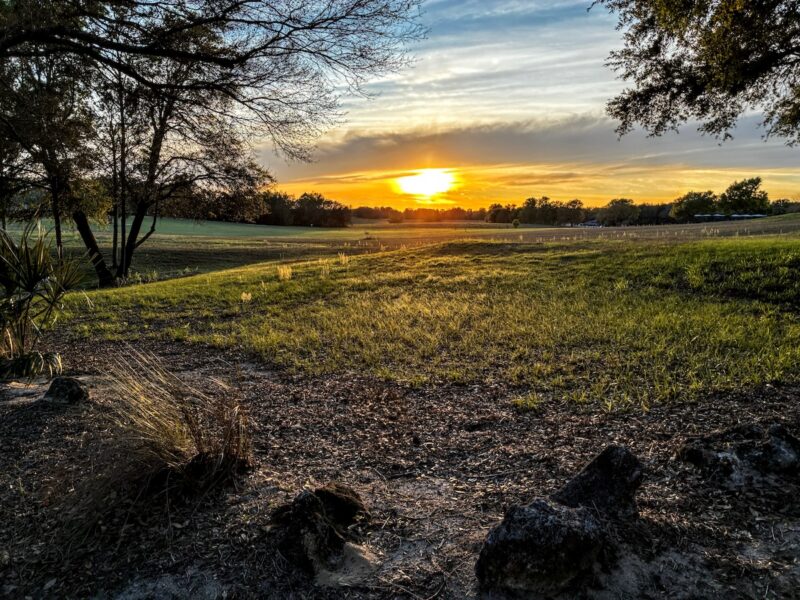 Sunset over driving range at On Top of the World Golf Club