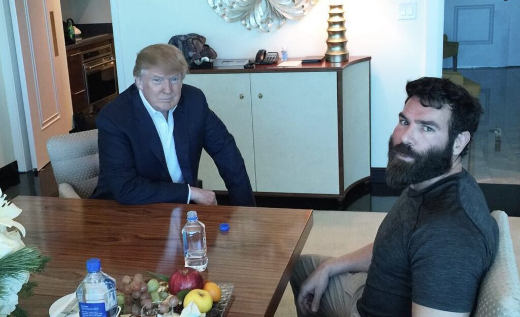 Dan Bilzerian sitting with Donald J. Trump