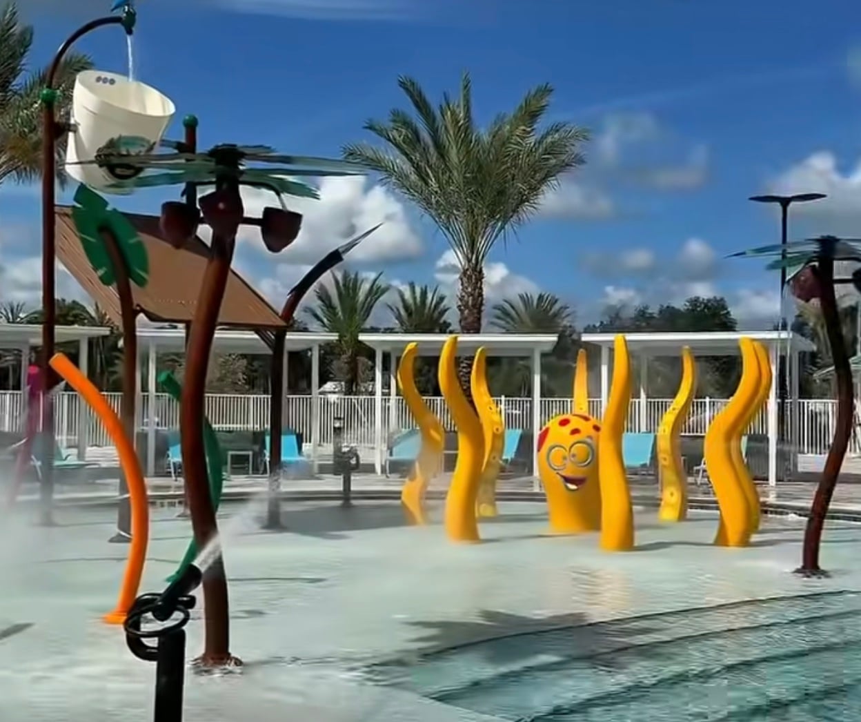 A water bucket and splash pad are some of the many amenities at the park.