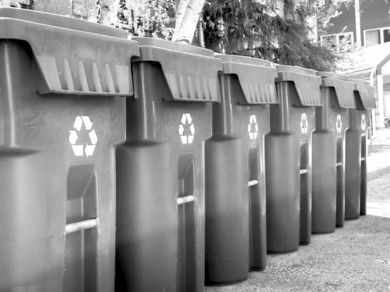 Recycling bins in black and white