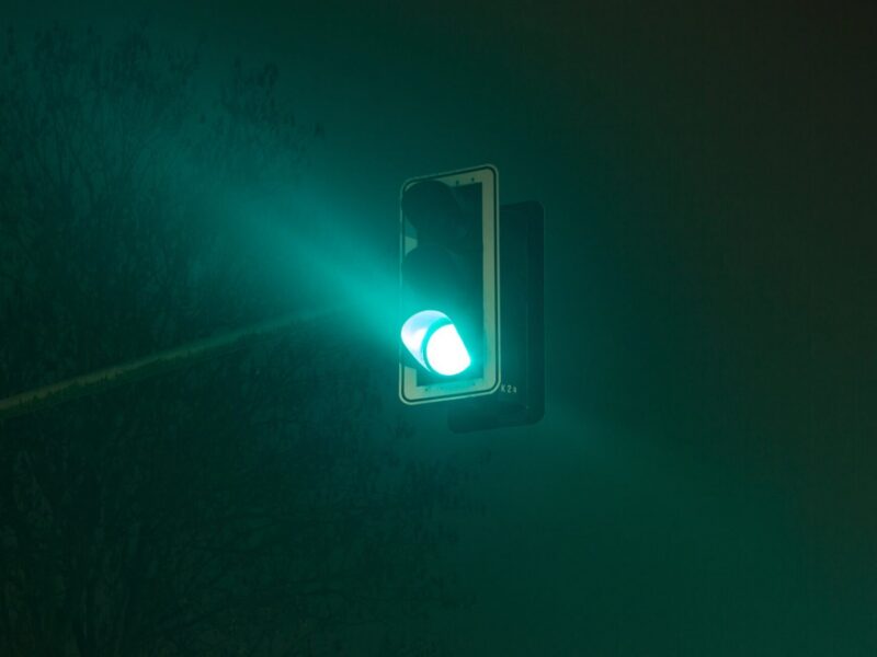 A green traffic light, stoplight at night