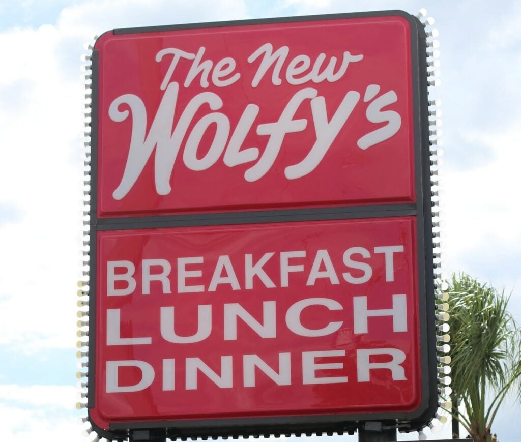 The New Wolfy s Breakfast LUnch Dinner sign